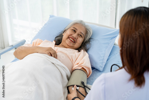 Daily inspection A nurse or caregiver of an elderly patient measures the patient's blood pressure and heart rate.