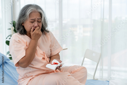 Elderly Asian patient admitted to hospital She had a cough so violent that she bled while sitting in a hospital bed.