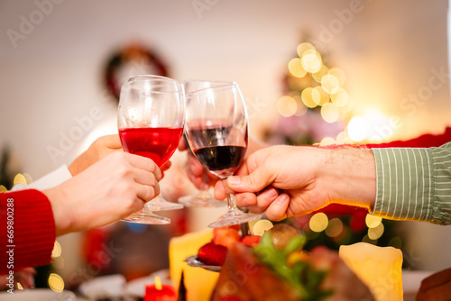 Happy - cheerful caucasian white family enjoy the time to celebrating the Christmas Eve and New Year festival together, caucasian white people family cheers a wine together in Christmas party.