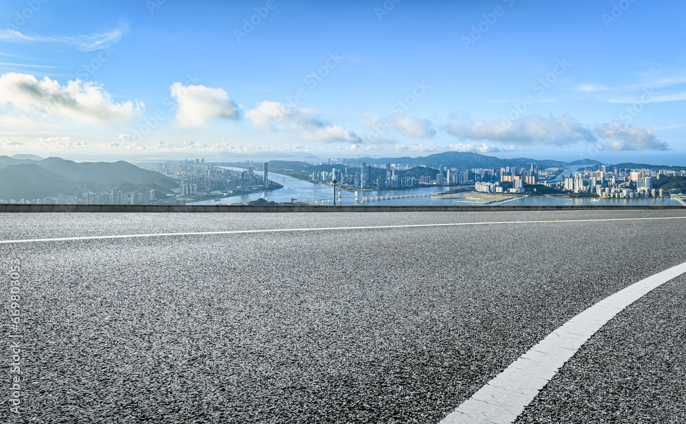 Fototapeta premium Asphalt road and mountain skyline background in Macau