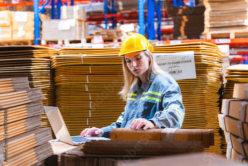 Factory manager, foreman worker checking stock inventory on good shelf in delivery storehouse of logistic storage warehouse, shipping distribution business, package box industry job for retail market