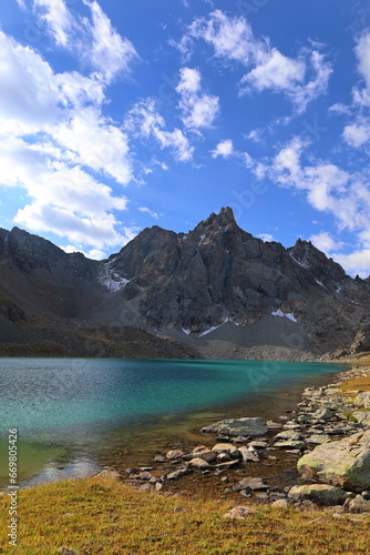 Fototapeta Naklejka Na Ścianę i Meble -  Third stage of Ak-Suu Traverse trek  - Boz-Uchuk lakes in Tian Shan mountains, Karakol, Kyrgyzstan