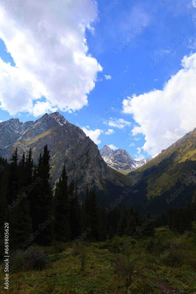 Obraz premium Eighth stage of Ak-Suu Traverse trek from Ala-kol lake to Karakol Gorge in Karakol national park, Kyrgyzstan