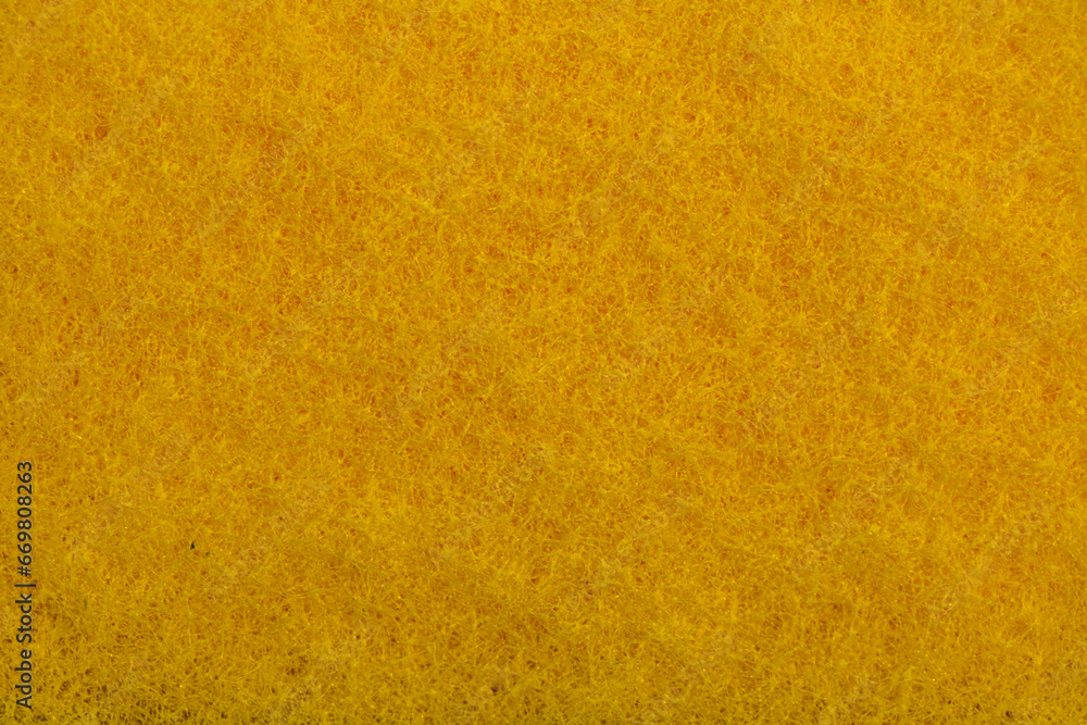 Sponge texture background. Close-up of yellow bath sponge with porous structure for background. Macro photo. Sponge texture background. Close-up of yellow bath sponge with porous structure for background. Macro photo.