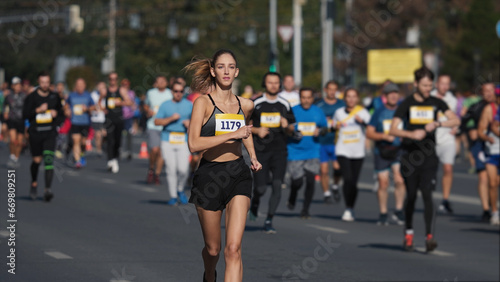 Female jogger run marathon. Thin girl work out. Woman runner jog long distance. Finish line road. Sportswoman overtake man. Sporty athlete train. Fast sprint champion. Fit sport body. Active city life