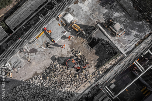 Aerial drone photo of demolition site and construction workers photo