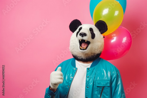 Man wearing a panda mask while standing on colored background, funky style, party advertising, happy panda mask photo