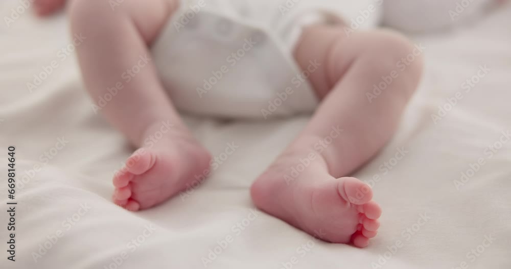 Sleeping, adorable and feet of baby on bed for child care, dreaming and relax in nursery. Family, cute and closeup of toes of innocent newborn infant for health, wellness and development at home Sleeping, adorable and feet of baby on bed for child care, dreaming and relax in nursery. Family, cute and closeup of toes of innocent newborn infant for health, wellness and development at home