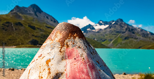 Alpine summer view with details of a rusty buoy at Sylvretta reservoir, Sylvretta-High-Alps-Street, Bielerhoehe, Vorarlberg, Tyrol, Austria photo