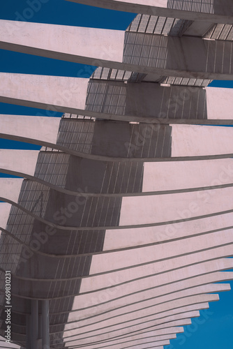 Architectural structure in the city in white color with blue sky. photo