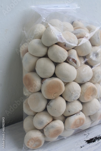 Indonesian snack called ndok bulus in plastic on the table photo