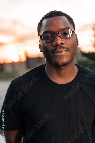 Young african man portrait standing in the street