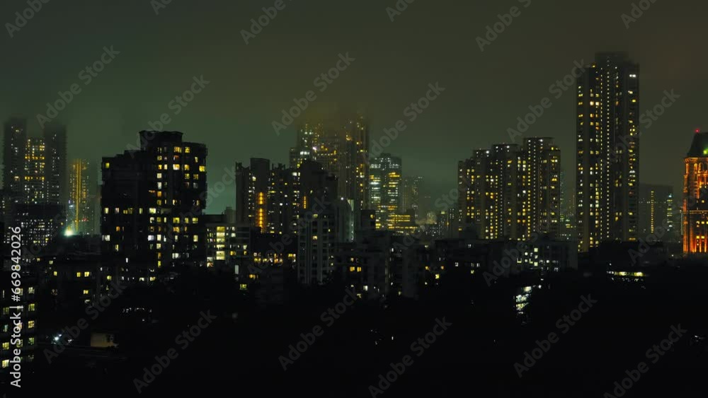 Cinematic aerial view of Mumbai's downtown night scene. Central Mumbai's cityscape and skyline- Lalbaug-Parel, Worli, Prabhadevi. beautiful modern buildings, bright glowing lights, and roads. Cinematic aerial view of Mumbai's downtown night scene. Central Mumbai's cityscape and skyline- Lalbaug-Parel, Worli, Prabhadevi. beautiful modern buildings, bright glowing lights, and roads.