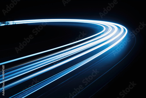 Long exposure capturing car blue speed light trails in a tunnel. High quality photo