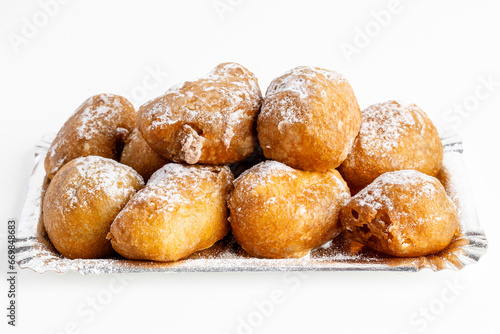 Plate of buñuelos de viento with cream and truffle typical dessert of the day of the saints in Spain
