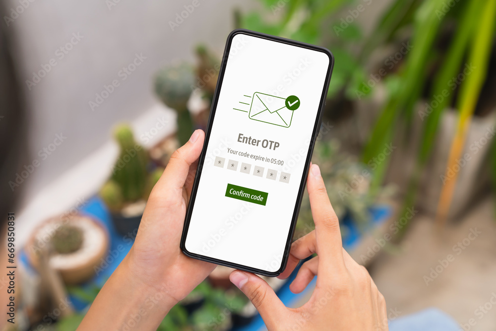 Hand using smartphone and mobile OTP secure verification on send to email with enter password for login banking account on on desk. - obrazy, fototapety, plakaty 