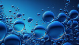 Several air bubbles in a blue liquid background
