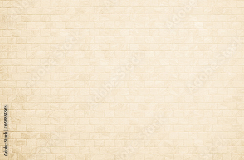 Empty background of wide cream brick wall texture. Beige old brown brick wall concrete or stone textured, wallpaper limestone abstract flooring. Grid uneven interior rock. Home decor design backdrop.