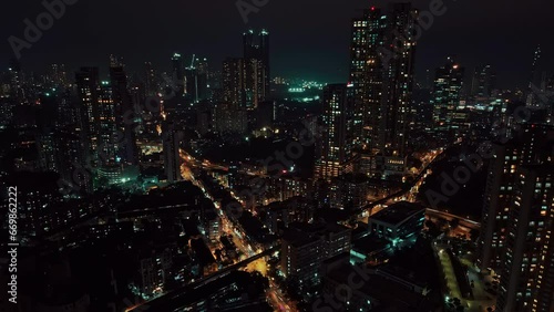 Cinematic aerial view of Mumbai's downtown night scene. Central Mumbai's cityscape and skyline- Lalbaug-Parel, Worli, Prabhadevi. beautiful modern buildings, bright glowing lights, and roads. photo