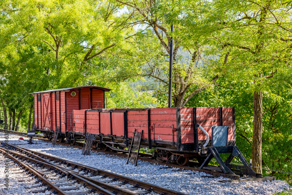 Old wooden planks covered freight train wagon in the countryside, Serbia, Europe Old wooden planks covered freight train wagon in the countryside, Serbia, Europe