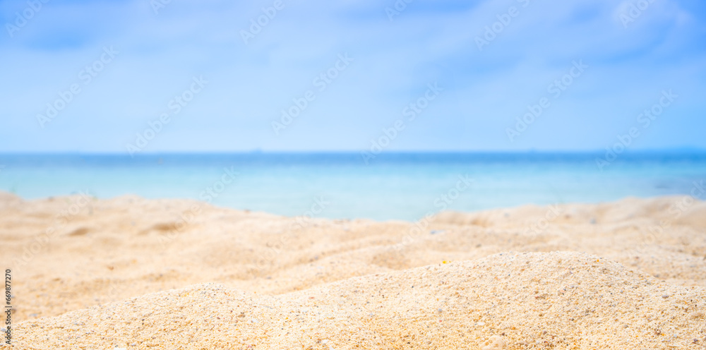 Beach sand background for summer vacation concept. Beach nature and summer seawater with sunlight light sandy beach Sparkling sea water contrast with the blue sky Beach sand background for summer vacation concept. Beach nature and summer seawater with sunlight light sandy beach Sparkling sea water contrast with the blue sky