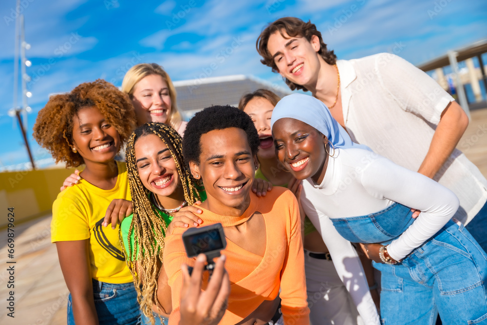 Transgender person talking a selfie with friends Transgender person talking a selfie with friends