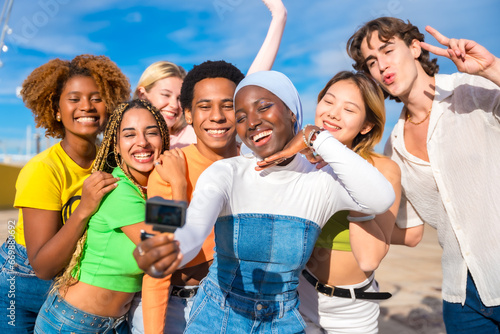 Muslim woman taking a selfie with friends