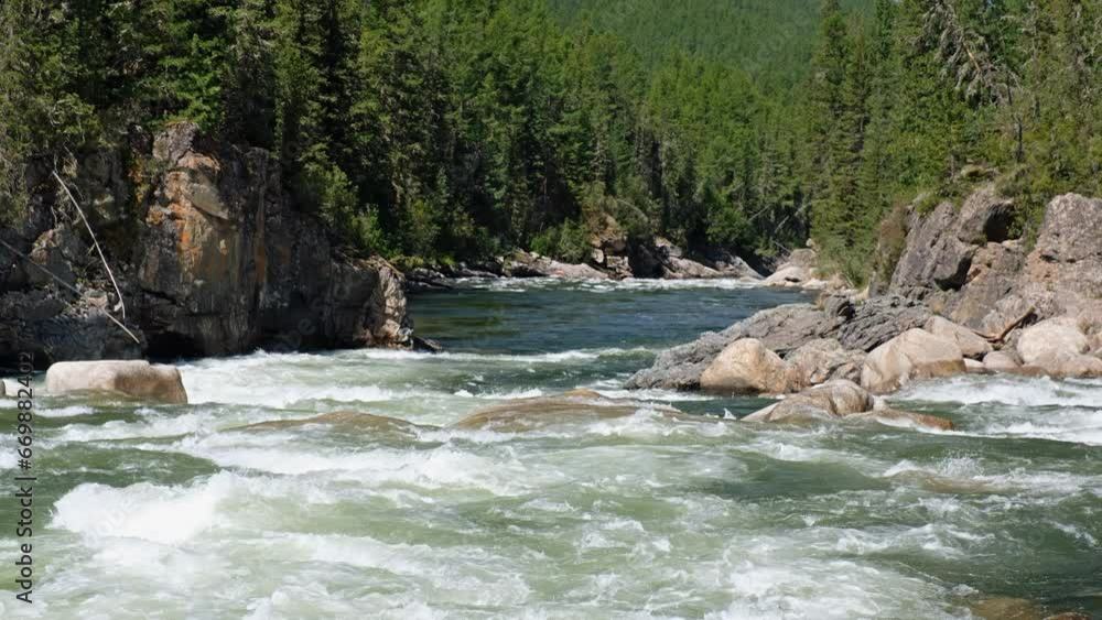 Video of Altai river Chulyshman. On the river banks there is siberian larch taiga forest. Video of Altai river Chulyshman. On the river banks there is siberian larch taiga forest.
