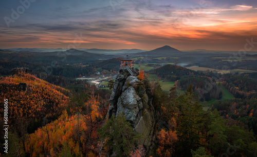 Jetrichovice, Czech Republic - Aerial panoramic view of Mariina Vyhlidka (Mary's view) lookout with a beautiful Czech autumn landscape and colorful golden sunset sky in Bohemian Switzerland region photo