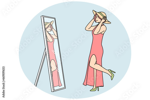 Young woman in dress, shoes, tries on hat in front of mirror. Girl chooses look for summer walk. Lady enjoys shopping, refreshes wardrobe. Vector linear colored illustration isolated on blue.
