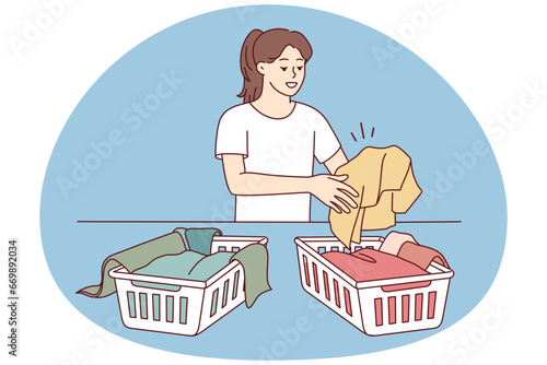Woman sorting dirty clothes for washing. Girl gathering laundry in baskets in laundromat. Housework and housekeeping. Vector illustration.