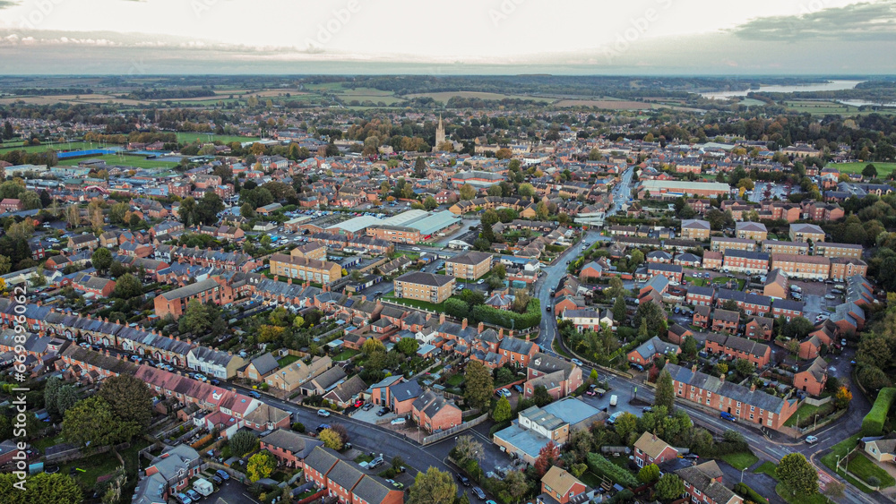 Aerial view 4k small town at sunset in Rutland, UK. 
