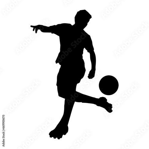 Silhouette of a man playing soccer. Silhouette of a football player in action pose. © anom_t