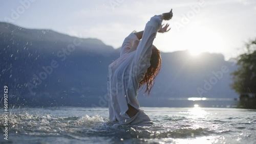 Woman dancing in a lake