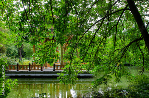 Munich Bavaria Germany -September 1 2023 in munich west park view of the pagoda through the foliage of the trees