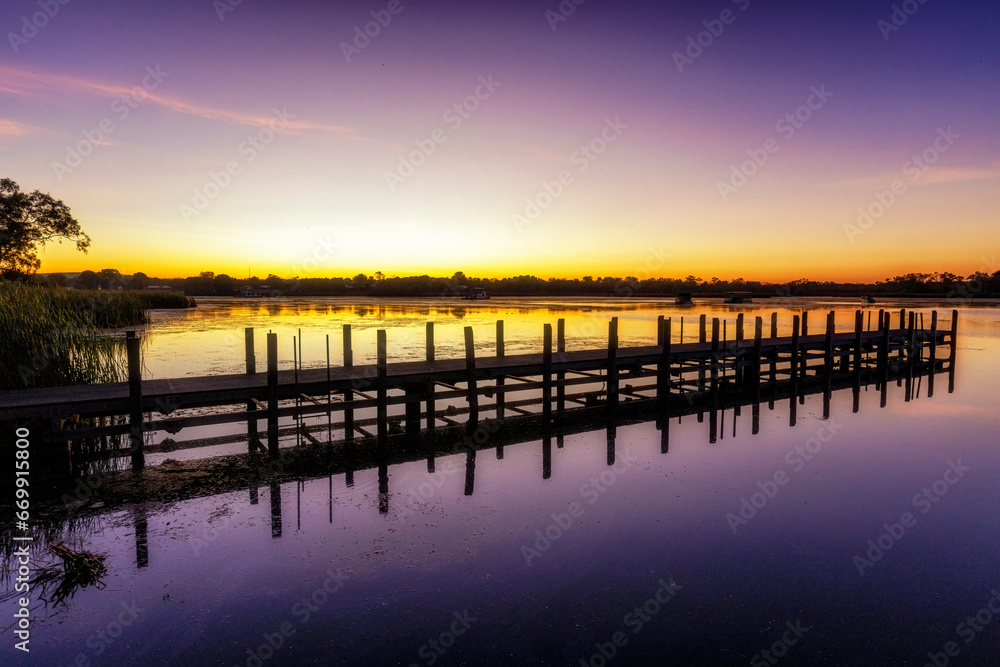 Dawn with jetty at Lily Creek Lagoon, Kununurra, Kimberley, West Australia, Australia