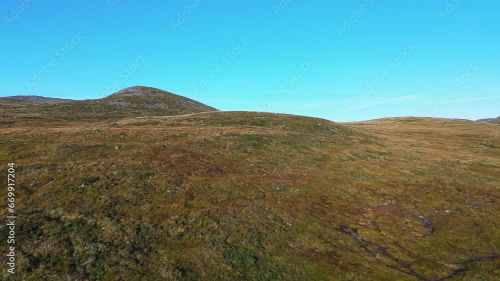 Aerial moving low over the hills near over Syvde, Vanylven Municipality, Norway. Drone dolly forward shot Aerial moving low over the hills near over Syvde, Vanylven Municipality, Norway. Drone dolly forward shot