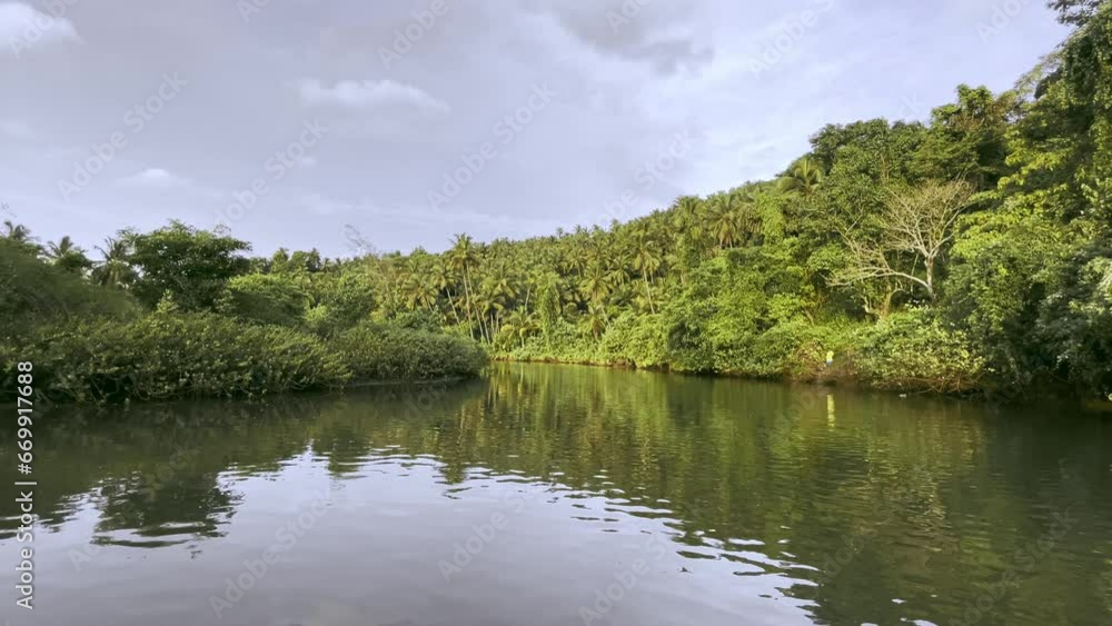 Saleri River surounded by nature on sunny day Goa India 4K Saleri River surounded by nature on sunny day Goa India 4K
