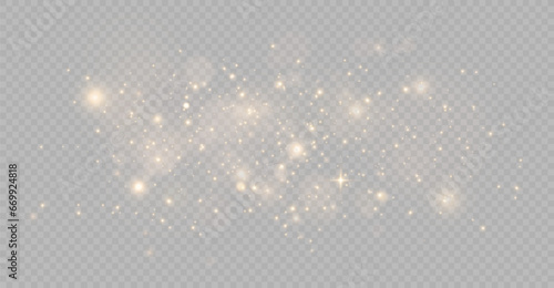 The light of gold dust. bokeh light effect background. Christmas glowing dust background. Yellow flickering glow with confetti bokeh light and particle motion. The dust sparks and golden stars shine.  photo