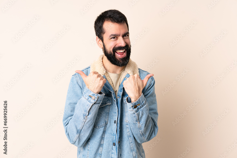 Caucasian man with beard over isolated background with thumbs up gesture and smiling Caucasian man with beard over isolated background with thumbs up gesture and smiling