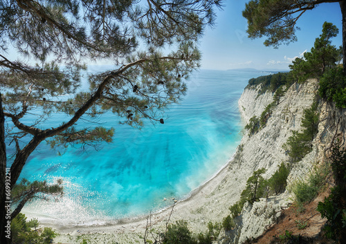 Blue azure sea against a background of white sheer cliffs. Seascape of coastline, beautiful nature, landscape. Tourism travel