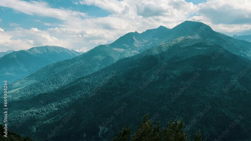 View of the mountain range near Mount Zakan. The top of the mountain node of the western part of the main ridge of the Greater Caucasus. Zakan Peak is the beginning of the Magisho mountain range. 4К View of the mountain range near Mount Zakan. The top of the mountain node of the western part of the main ridge of the Greater Caucasus. Zakan Peak is the beginning of the Magisho mountain range. 4К