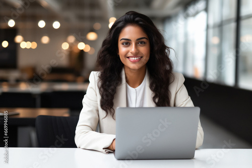 Indian businesswoman using laptop