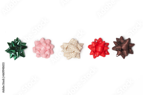 Fototapeta Naklejka Na Ścianę i Meble -  Mini gift wrapping star bows isolated on white background. Christmas or birthday party decoration.