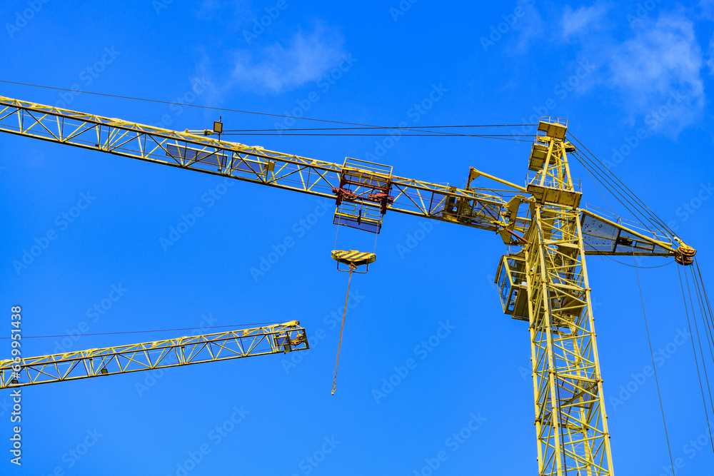 Construction site background. Construction crane against the sky.. Construction site background. Construction crane against the sky..