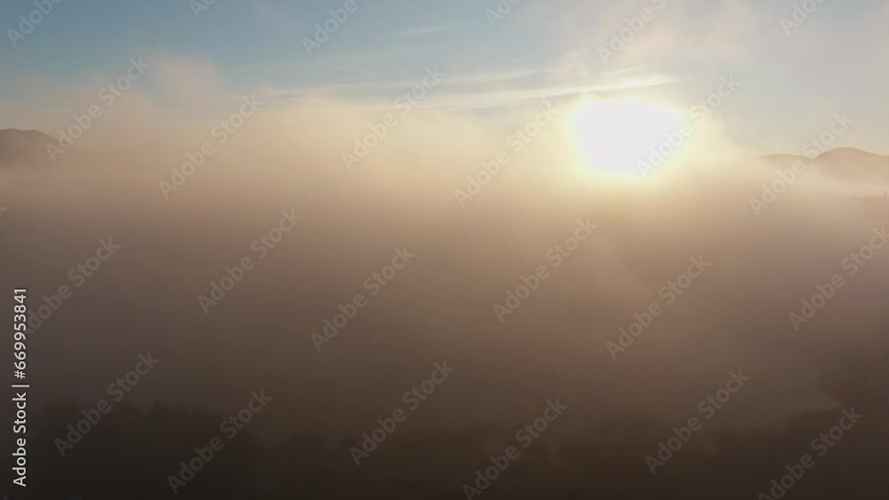 Aerial flight through the morning mist in Lika, Croatia. Aerial flight through the morning mist in Lika, Croatia.