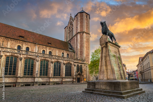 Statue of Lion and Cathedral in Braunschweig, Germany photo