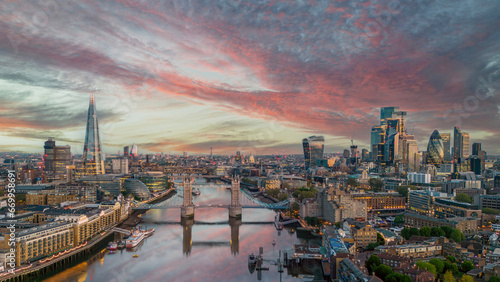 London, England. Aerial view of London at sunrise looking over Tower Bridge, Tower of London, river Thames and Financial district. 