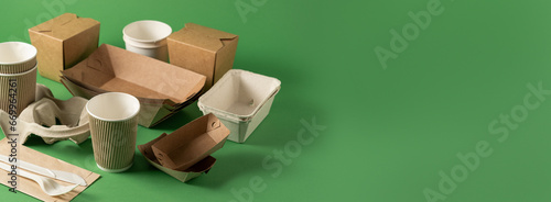 Packaging concept - selection of paper craft packaging on green photo