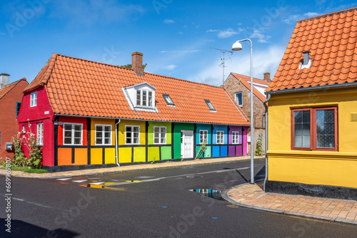 Denmark, Bornholm, Ronne, Empty street in front of rainbow-coloured house